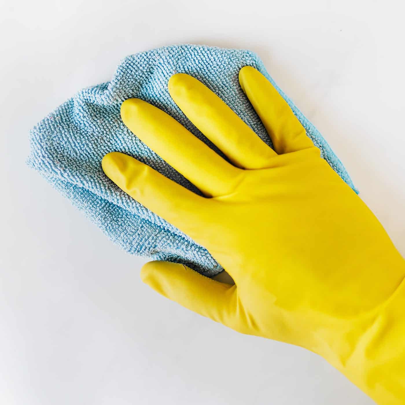 Cleaner wiping a kitchen counter in a Jacksonville home
